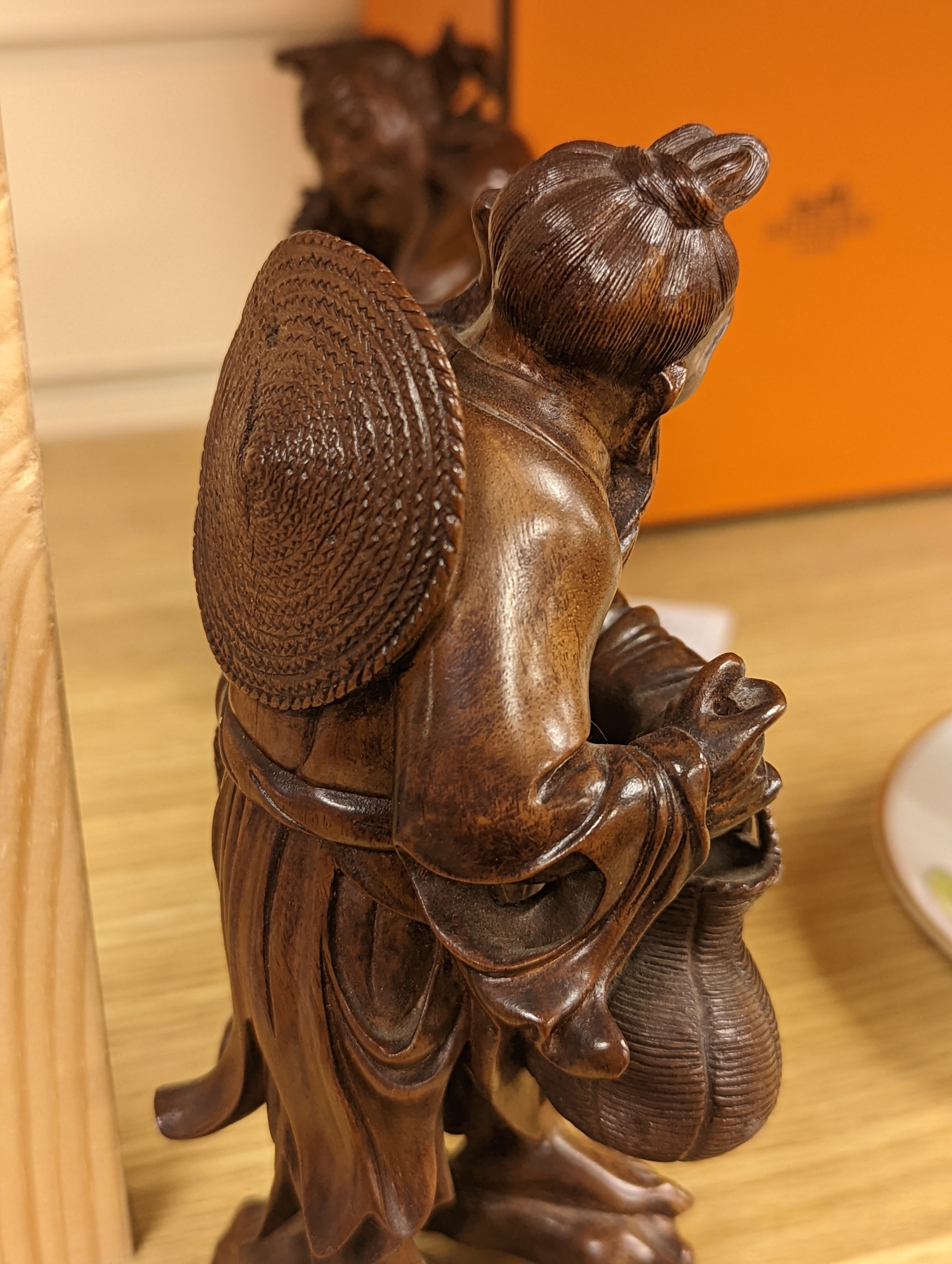 Two Chinese hardwood figures of a fisherman and a old man holding peaches 16cm